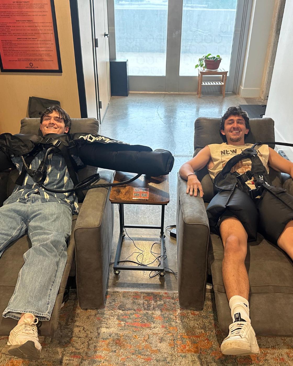Nick and Matthew Montes in NormaTec recovery boots at Generator Athlete Lab